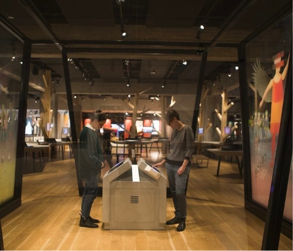 Visitors use an interactive display. ANU – Museum of the Jewish People