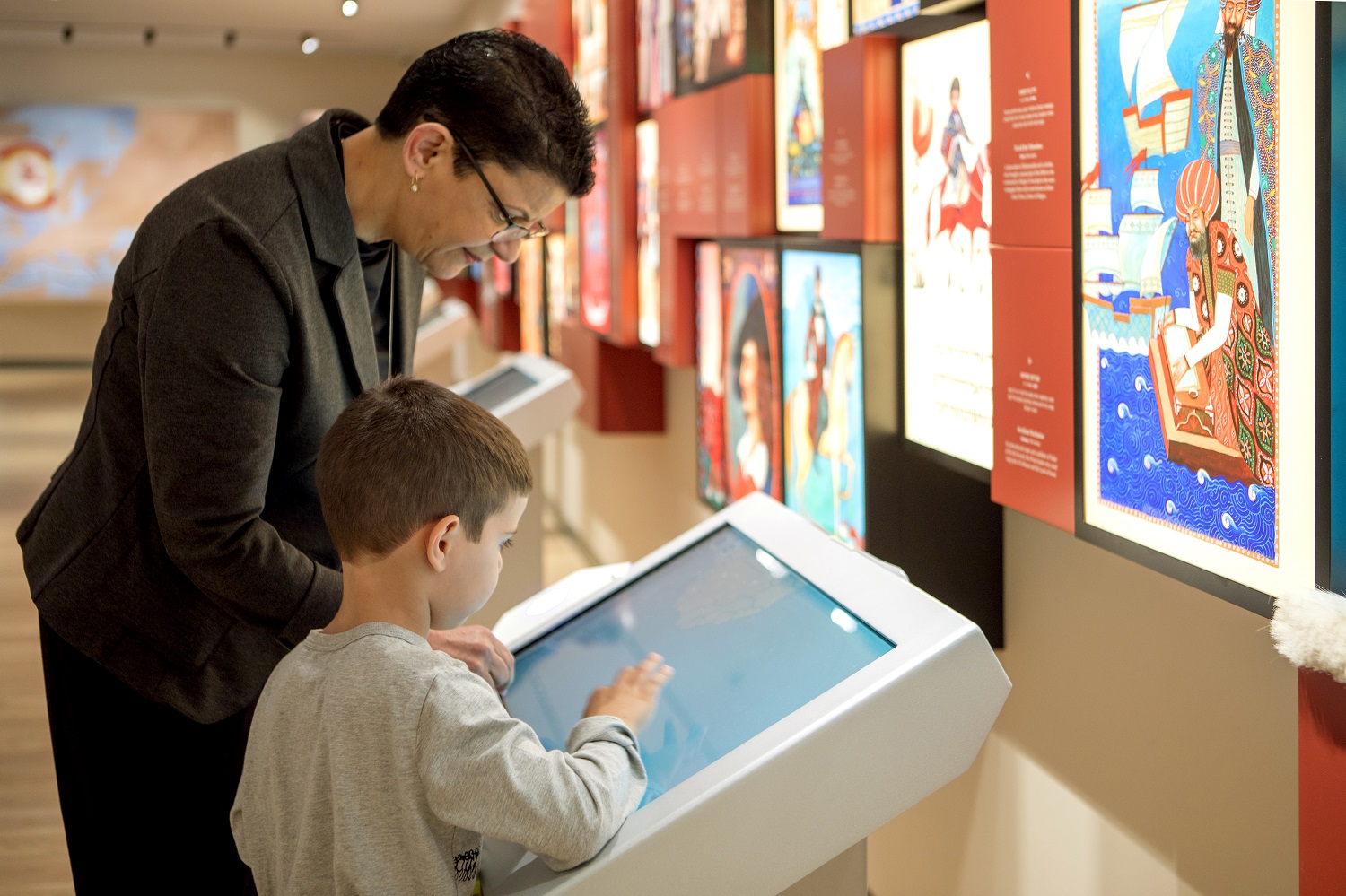 Visitors use an interactive display at ANU – Museum of the Jewish People