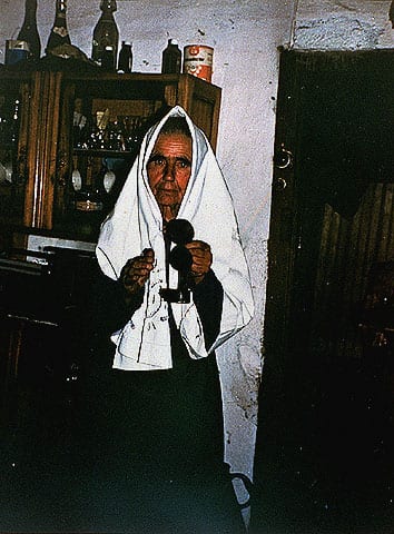 Woman from the Converso community lighting Sabbath candles in her home, Belmonte, Portugal, 1970s. Beit Hatfutsot, the Oster Visual Documentation Center, courtesy of Paulo Amilcar, Portugal