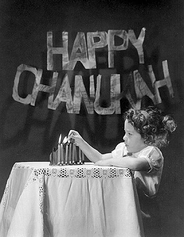 Little girl lighting Hanukah candles. Knoxville, Tennessee, U.S.A. 1954. Photo: Rita Kurz Lewis. Beit Hatfutsot, the Oster Visual Documentation Center, courtesy of Rita Kurz Lewis, U.S.A.