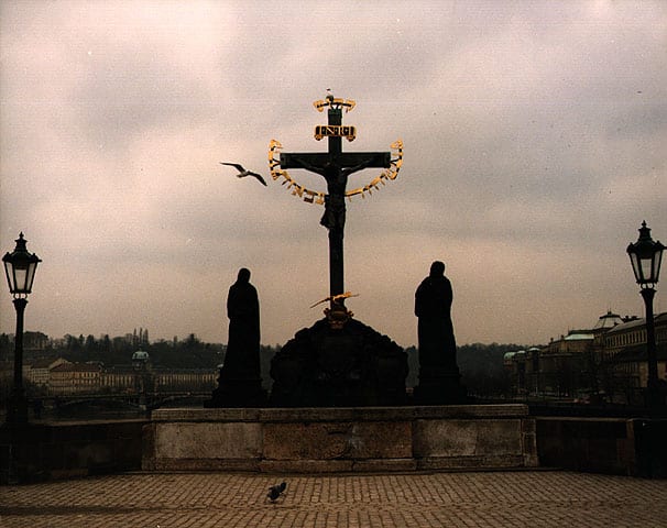 Christ statue on Karl Bridge with Hebrew inscriptions in gold, Prague, Czechoslovakia, 1987. When the bridge was built in c1650, a Jew said blasphemy remarks about it. The Jews were therefore taxed in order to pay for the gold lettering around the statue Photo. Beit Hatfutsot, the Oster Visual Documentation Center, courtesy of Dr. Theodore Cohen, USA