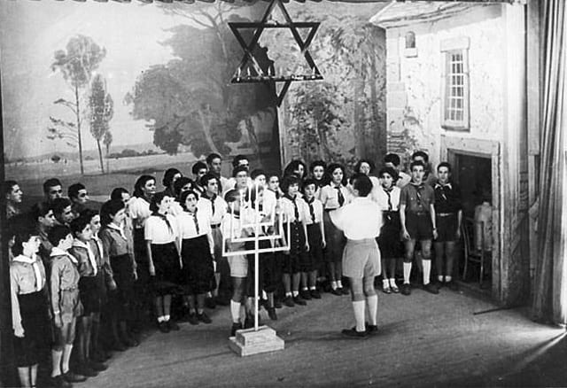 Choir made of members of the youth movement at a Hanukkah Party, Tunis, Tunisia, 1950's. Beit Hatfutsot, the Oster Visual Documentation Center, courtesy of Ron and Ester Debache