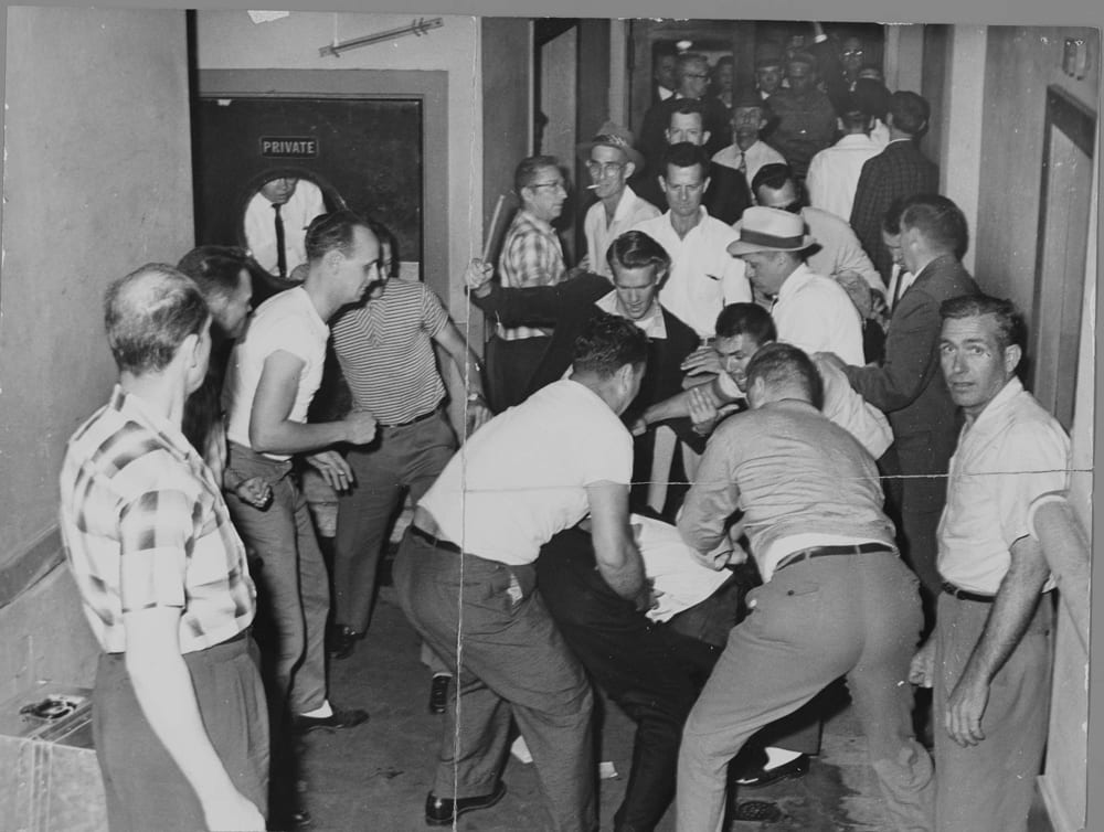 A mob of racists beats Freedom Riders in Birmingham, Alabama, U.S.A. This picture was reclaimed by the FBI from a local journalist who also was beaten and whose camera was smashed.