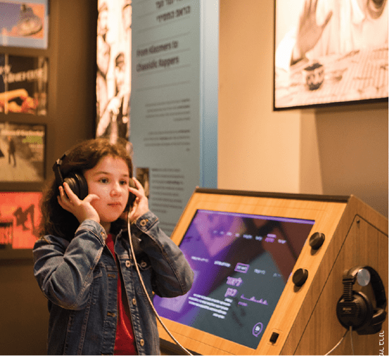 A girl using an interactive exhibit