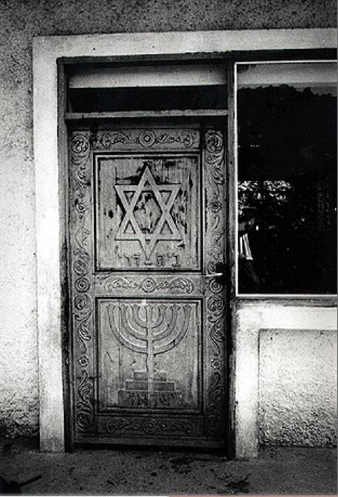 Magen David and menorah on the entrance door to the house of Ronald Reategio Levi, Iquitos, Amazonas region, Peru 1995. Photo: Ariel Segal, Jerusalem. Beit Hatfutsot, the Oster Visual Documentation Center, courtesy of Ariel Segal, Jerusalem