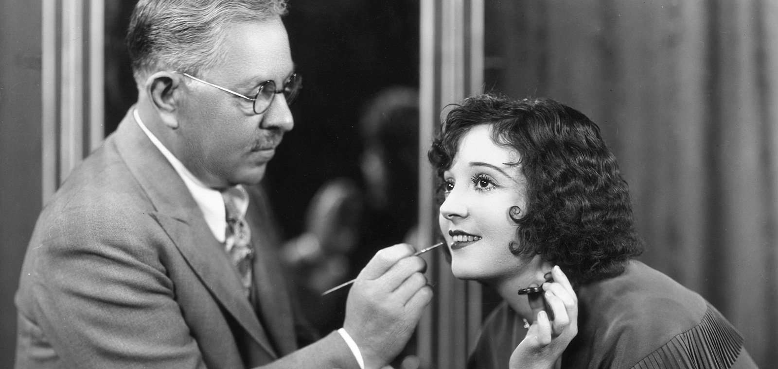 Max Factor working on the make-up of an Hollywood actress. from Max Factor official site www.maxfactor.com