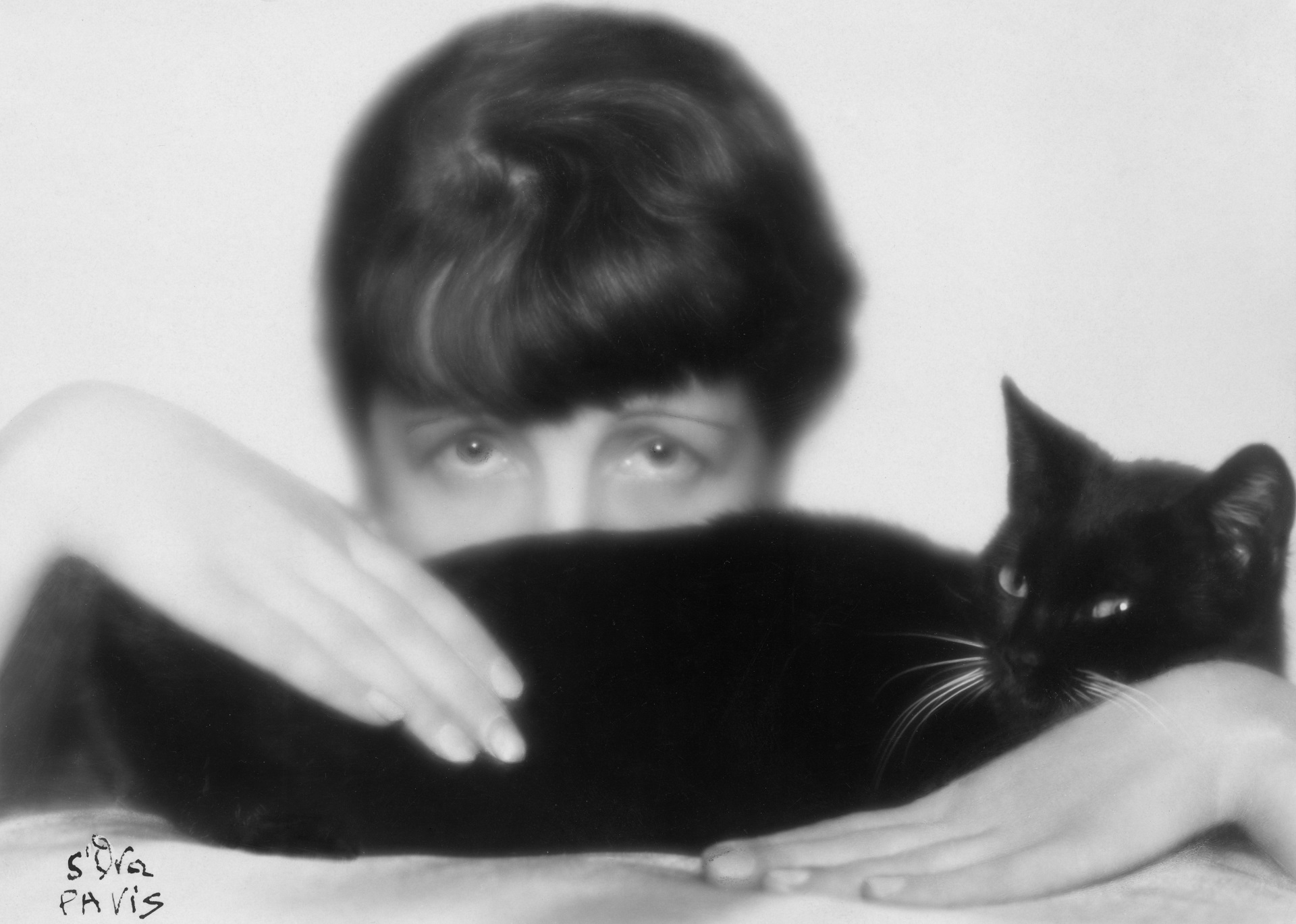 Picture by Madame d'Ora (Dora Kallmus), Austria. Self-portrait with a black cat